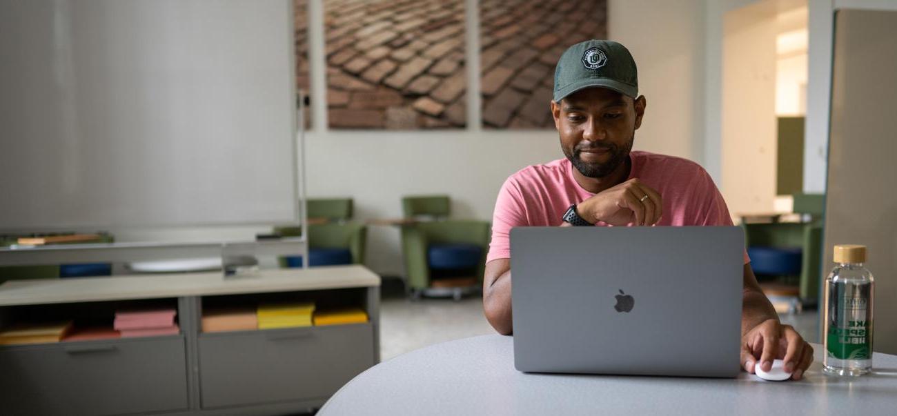 An Ohio University student works on their laptop